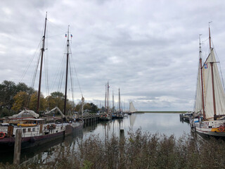 Fototapeta na wymiar Sailships in the harbor of Sloten
