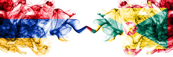 Armenia vs Grenada smoky mystic flags placed side by side. Thick colored silky abstract smoke flags