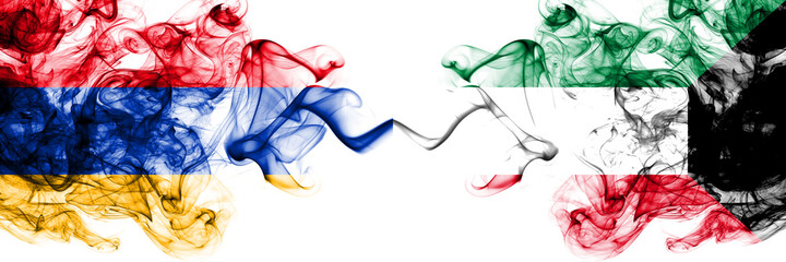 Armenia vs Kuwait, Kuwaiti smoky mystic flags placed side by side. Thick colored silky abstract smoke flags