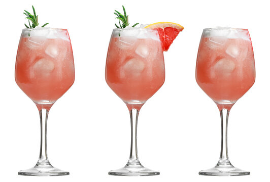 Alcoholic drink with tropical fruits and herbs and ice. Three alcoholic cocktails isolated on white.copy space