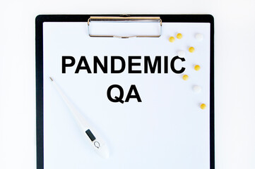 On the tablet for the letter, the text of PANDEMIC, a tablet and a stethoscope.