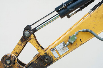close up of the excavator hydraulic cylinder on a white background
