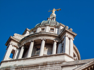 Obraz premium Scales of Justice of the Central Criminal Court fondly known as the Old Bailey London England, UK which dates from 1902 and is a popular travel destination tourist attraction landmark of the city