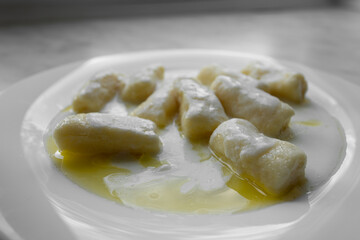 Closeup of dumplings with cottage cheese or Dumplings without filling - slavic light dish, vegetarian food, healthy breakfast