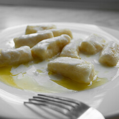 Closeup of dumplings with cottage cheese or Dumplings without filling - slavic light dish, vegetarian food, healthy breakfast