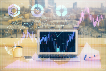 Double exposure of graph and financial info and work space with computer background. Concept of...
