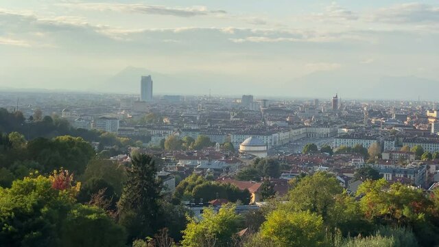 Panoramic view of Turin with Mole Antonelliana, Vittorio's Square, and the Queen's vineyard at the forefront.