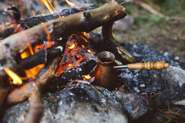 Turk with coffee on a campfire in a hike in nature