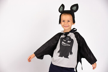  Cute bat smiling and happy preparing for Halloween Happy Halloween. Handsome caucasian kindergarden boy. Photo on a white background.