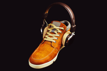 Abstract combination of male shoes and headphone