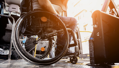 A man in a wheelchair inside of a specialized vehicle 
