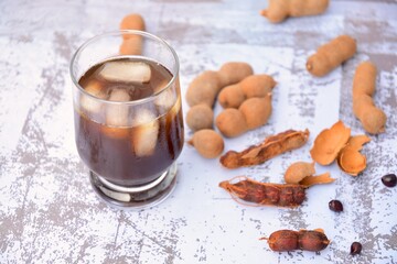 Tamarind juice, ripe tamarind fruit and seeds 
