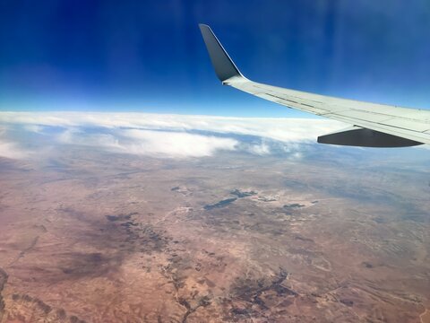 scenic view from the window. Higher than clouds. Beautiful cloud, blue sky. Traveling by plane, adventure. Flight over Europe. Air transport. Aviation. Holiday in other country. Poster