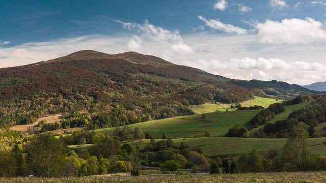 Time Lapse 4K Footage of Tarnica Peak in Bieszczady Mountains at Fall Season. Colorful Grass and Foliage on Trees on Poloniny. Autumn Vibes and Clouds Moving on Sky.