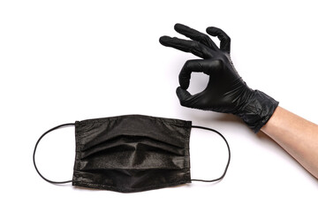 Human hand in protective glove and face protective masks isolated on white background