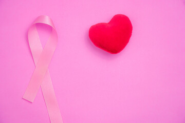 breast cancer awareness ribbon on pink background