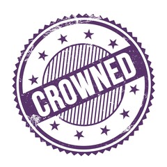 CROWNED text written on purple indigo grungy round stamp.