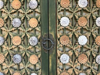 Wooden door with old floral decorative pattern in Korean traditional temple