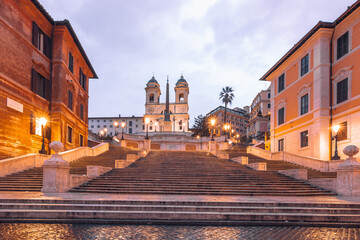 Fototapeta na wymiar Italy Rome the Spanish stairs in the morning people empty and beautiful surroundings with old houses, illuminated