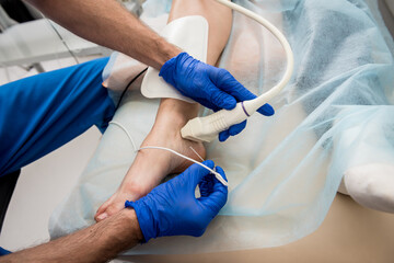 Cardiologist use tubes and ultrasound for radiofrequency catheter ablation.