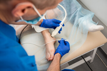 Cardiologist use tubes and ultrasound for radiofrequency catheter ablation.