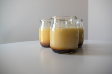 Homemade crème caramel chilling in a crystal glass.