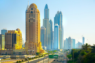 Fototapeta na wymiar UAE United Arabs Emirates. Dubai marina skyscrapers from King Salman motorway. View at apartment buildings, hotels and office blocks, modern residential development of UAE