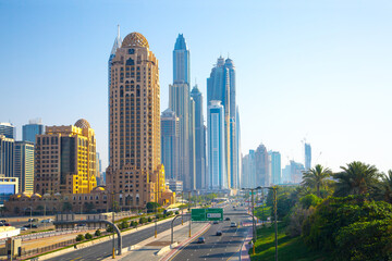 Fototapeta na wymiar UAE United Arabs Emirates. Dubai marina skyscrapers from King Salman motorway. View at apartment buildings, hotels and office blocks, modern residential development of UAE