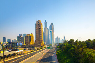 Fototapeta na wymiar UAE United Arabs Emirates. Dubai marina skyscrapers from King Salman motorway. View at apartment buildings, hotels and office blocks, modern residential development of UAE