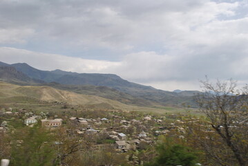 
yerevan city armenia excursion travel totev temple stonehenge journey walk tour city suburb village road path people mountains slopes rocks road walls path nature temples ancient buildings