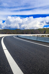 New asphalt road and mountain with sky cloud natural scenery.