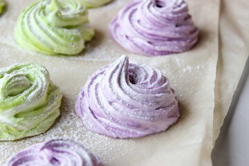 Homemade marshmallows in green and purple