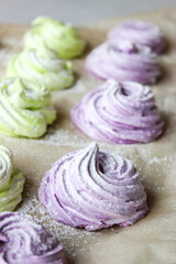 Obraz na płótnie Canvas Homemade marshmallows in green and purple