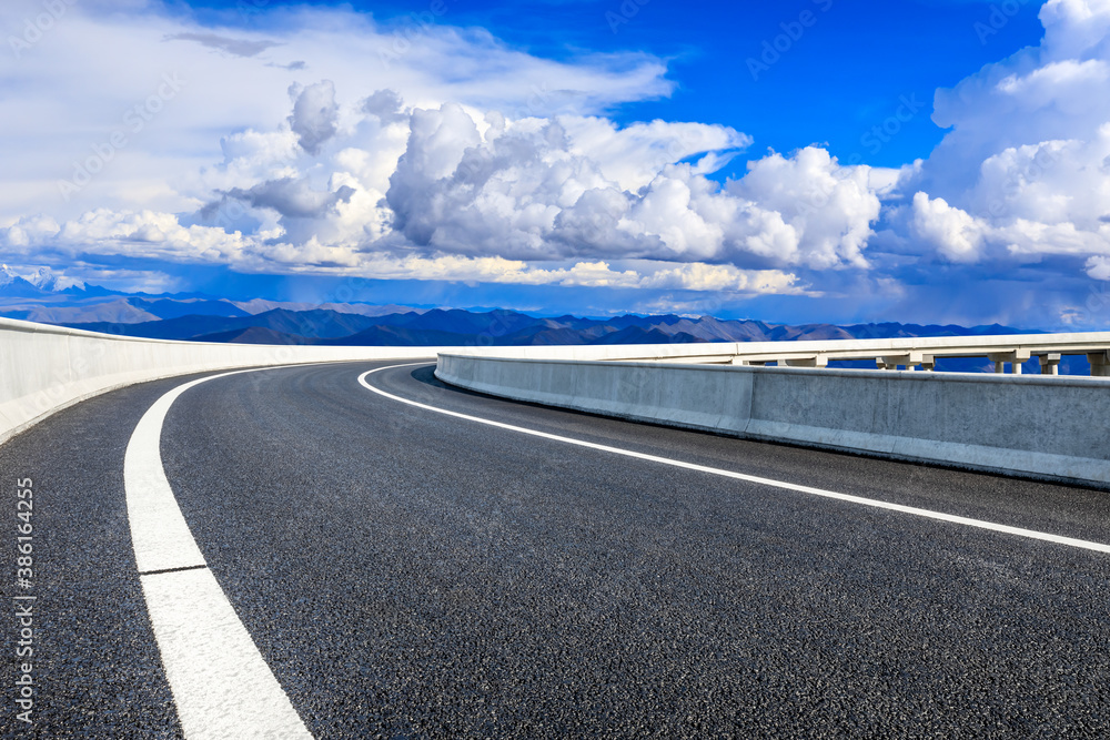 Wall mural new asphalt road and mountain with sky cloud natural scenery.