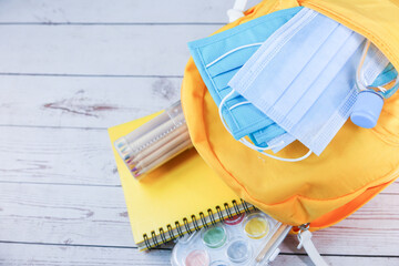 Student school bag pack with sanitizer, a face mask.