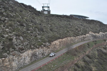 
yerevan city armenia excursion travel totev temple stonehenge journey walk tour city suburb village road path people mountains slopes rocks road walls path nature temples ancient buildings