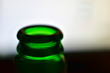 Green beer bottle neck on the screen background