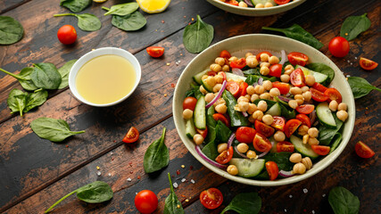 Chickpeas salad with tomato, cucumbers, red onion and greens. Dietary food. Vegan salad.