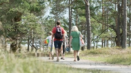 Family beach outing during sunny day