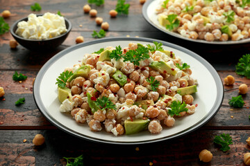 Chickpeas salad with feta cheese, avocado and herbs. healthy food