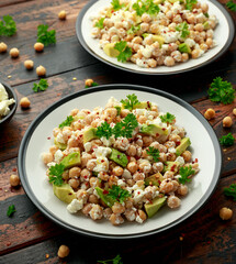Chickpeas salad with feta cheese, avocado and herbs. healthy food