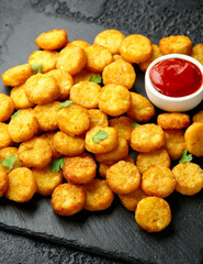 Naklejka na ściany i meble Mini hash browns, tater tots crispy golden potato bites served with jalapeno peppers dipped in ketchup