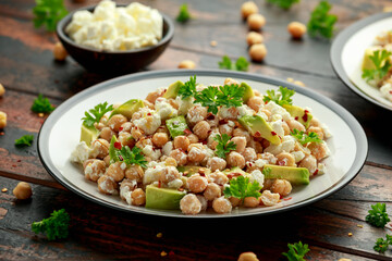 Chickpeas salad with feta cheese, avocado and herbs. healthy food