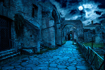 Roman Forum at night, Rome, Italy. Mystery creepy view of Ancient street in full moon.