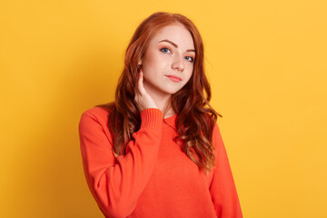 Cute woman with beautiful eyes, red long hair, gentle smile, cheerful woman having having pleased...