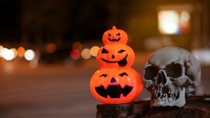 Scary pumpkins and skulls halloween at night