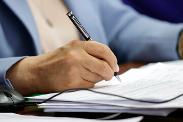 Hand holding a fountain pen