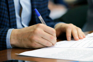 Hand holding a fountain pen