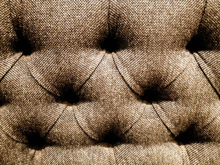 deep buttoned brown upholstery