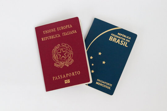 Top view of brazilian and italian passport on white background. Dual citizenship concept.